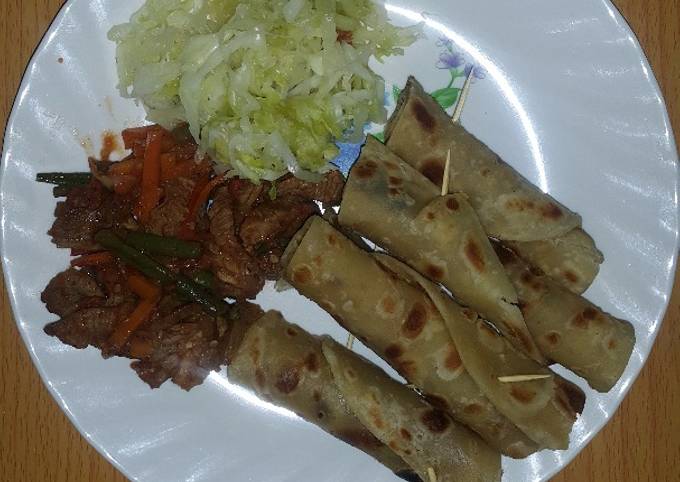 Beef served with chapati and steamed cabbage