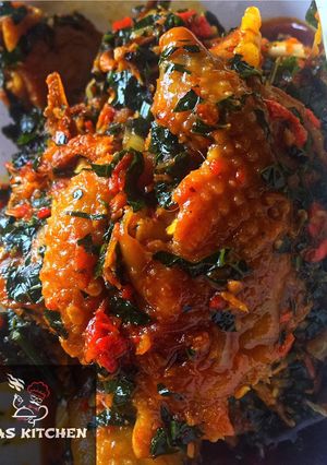 A picture of Ettas native chicken stew with ugu leaf.