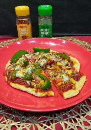 A picture of Cheesy crust veg Pizza in tawa.