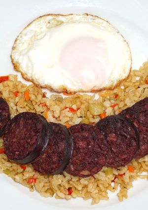 A picture of Grilled Blood Sausage and Brown Rice with Vegetables.