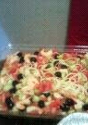 A picture of pasta salad with shrimp.