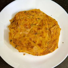 16 Layer Masala Laccha Paratha 🫓 A picture of 16 Layer Masala Laccha Paratha 🫓.