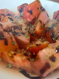 Una foto de Tomates Aliñados