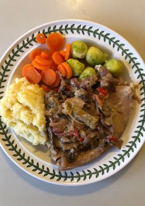 A picture of Pork Chops with cider, apple, mushrooms & crème fraîche.
