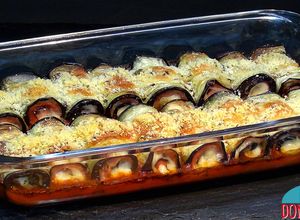 Foto principal de Rollitos de berenjena con jamón York y queso al horno