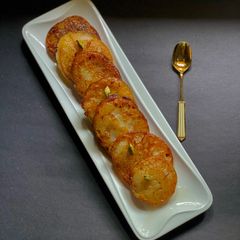 Ranga Aloo or Misti Aloo Malpua / Sweet Potato Malpua A picture of Ranga Aloo or Misti Aloo Malpua / Sweet Potato Malpua.