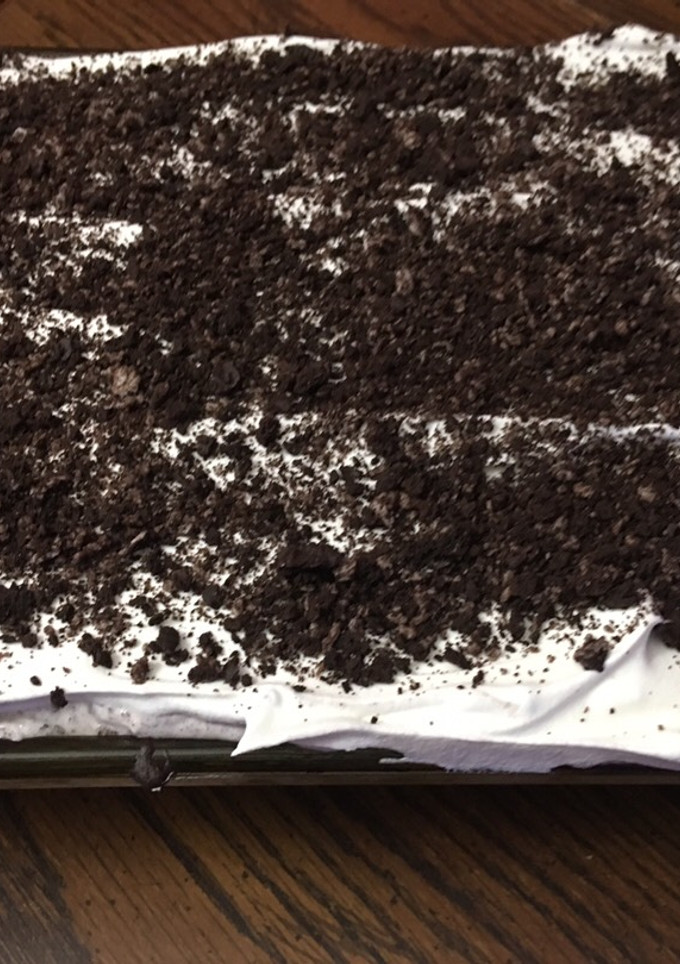 A picture of Cookies and cream poke cake.
