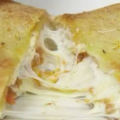 A picture of Cheesy Lasagna Stuffed Garlic Bread.