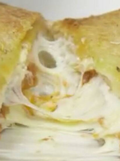 A picture of Cheesy Lasagna Stuffed Garlic Bread.