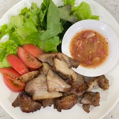 Roasted garlic marinated pork collar with spicy Thai-style sauce A picture of Roasted garlic marinated pork collar with spicy Thai-style sauce.