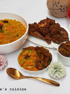 A picture of Stir fry veggies couscous with vegetables palm oil sauce.