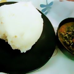 A picture of Pounded yam and Vegetables soup.