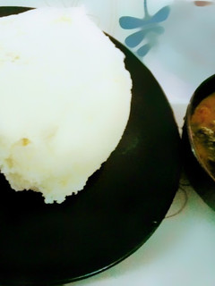 A picture of Pounded yam and Vegetables soup.