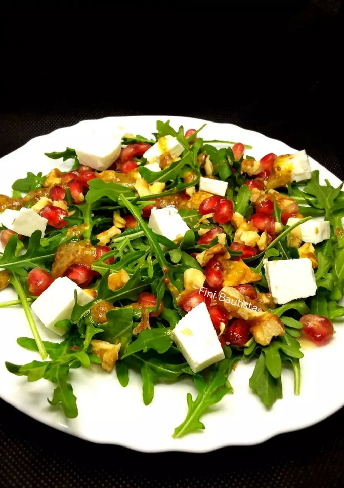 Una foto de Ensalada de rúcula y Granada