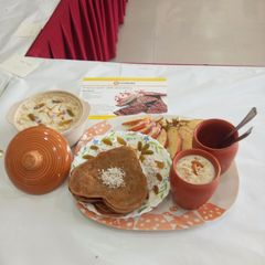 A picture of Rice puding with malpua.