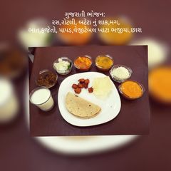 A picture of Rotli,bateta nu shaak,Moong,Keri no Ras,fajeto,rice,chass(buttermilk).