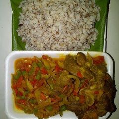 Goat meat sauce and ofada rice A picture of Goat meat sauce and ofada rice.