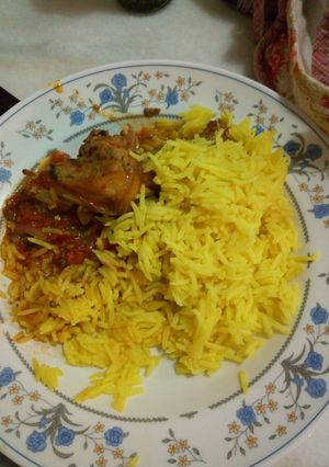 A picture of Turmeric rice and chicken stew.