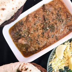 A picture of Kaleji Masala with Naan.