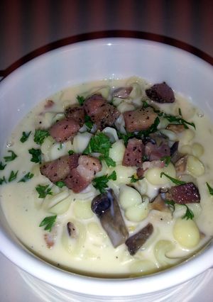A picture of Champagne/Truffle Mac-n-Cheese Wild Mushrooms, Pancetta & Smoked Gouda.