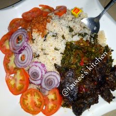 A picture of Dambun shinkafa with spinach sauce.