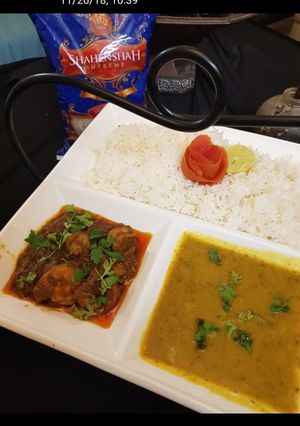 A picture of Garlic rice with daal chawal and prawn curry.