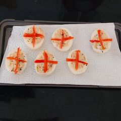A picture of My Devilled Eggs with Parsley, Mayonnaise + Chilli Sauce.