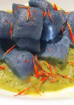 A picture of Blue Gnocchi with Zucchini Pesto and Stracchino Cheese.