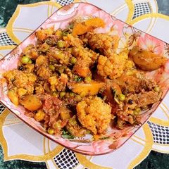 A picture of Aloo Gobhi Matar/ Potato Cauliflower Green Peas Dry Curry.