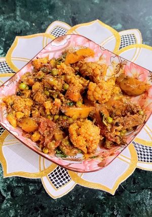 A picture of Aloo Gobhi Matar/ Potato Cauliflower Green Peas Dry Curry.