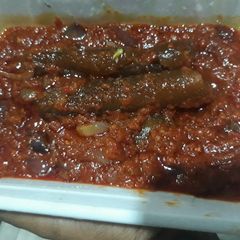 A picture of Tomato stew with pomo.