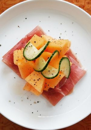 A picture of Cantaloupe Melon With Prosciutto And Cucumber.