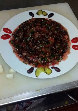 Una foto de Carpaccio de salmón
