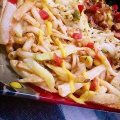 A picture of Chicken tikka microni with spicy spaghetti.