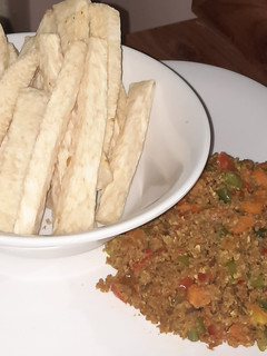 A picture of Fried yam with minced meat source.