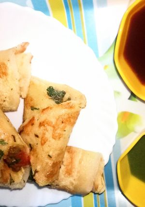 A picture of Egg Dosa masala roll.