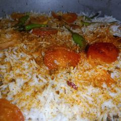 A picture of Smokey Chicken Biryani.