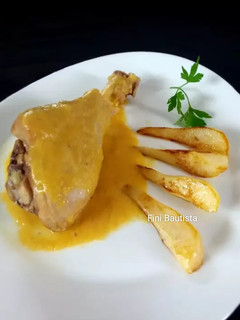 Una foto de Muslos de pavo en salsa