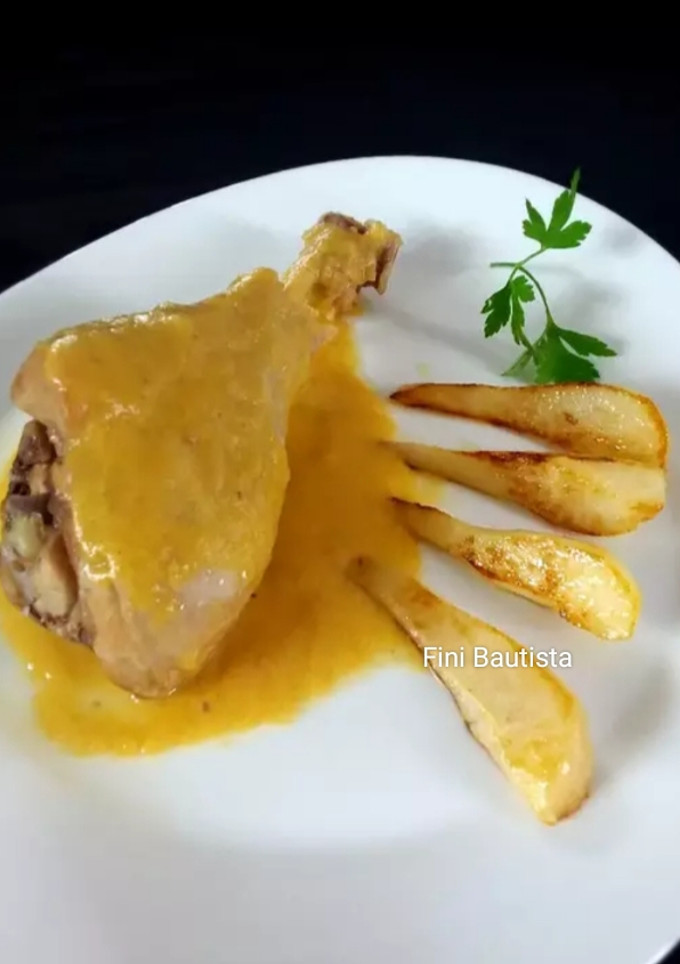 Una foto de Muslos de pavo en salsa