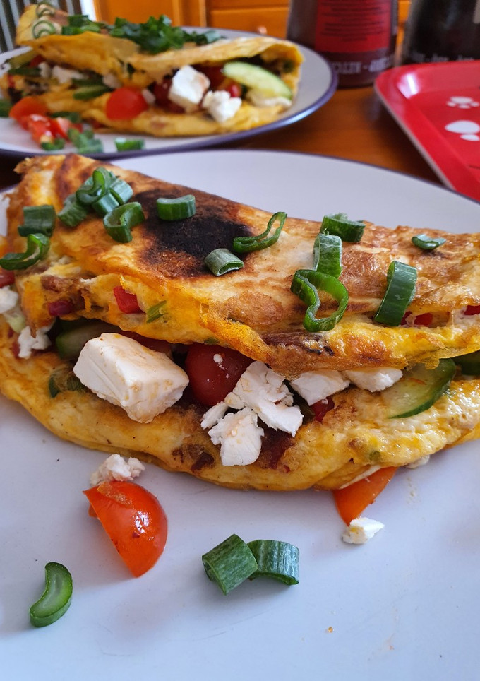 Una foto de Tortita de maíz con queso feta y bacon