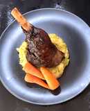 Slow-cooked lamb shanks infused with Irish whiskey, garlic and rosemary served with colcannon