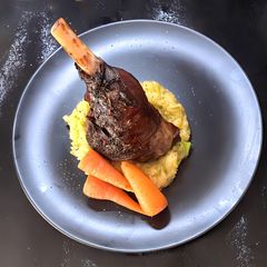 Slow-cooked lamb shanks infused with Irish whiskey, garlic and rosemary served with colcannon A picture of Slow-cooked lamb shanks infused with Irish whiskey, garlic and rosemary served with colcannon.