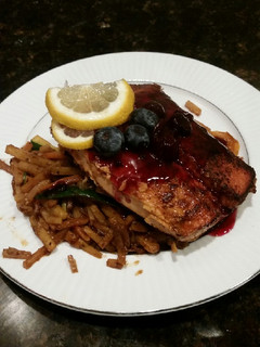 A picture of Brad's blackened salmon with blueberry balsamic reduction.