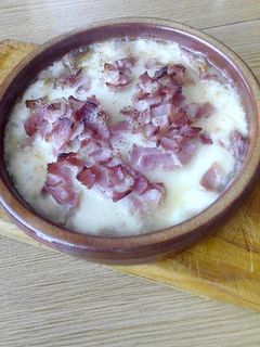 Una foto de Provolone al horno con bacon