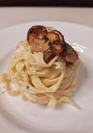 A picture of Fettuccine with Parmesan Cream and Porcini Mushrooms.