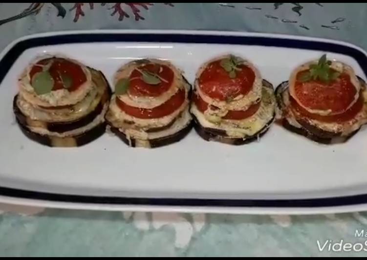 Millefoglie di melanzane uova di tonno e pomodori confit