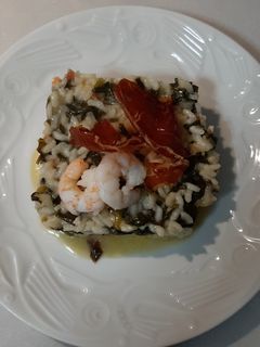 Una foto de Risotto con ibérico y langostinos
