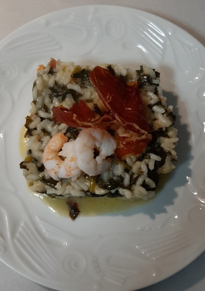 Una foto de Risotto con ibérico y langostinos