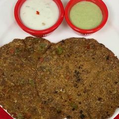 A picture of *Ragi & Oats Veggie Roti With Garlicky Herb Yogurt & Mint Dip*.
