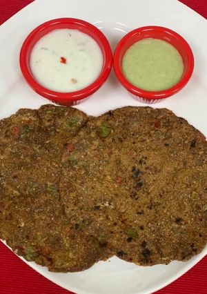 A picture of *Ragi & Oats Veggie Roti With Garlicky Herb Yogurt & Mint Dip*.